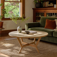 Light oak round dining table with a continuous rim and pedestal base. - detail view 1