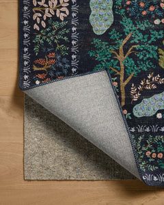 Corner fold detail of the Canopy Rug in Charcoal showing the floral border and back - Whats New Furniture Portland OR