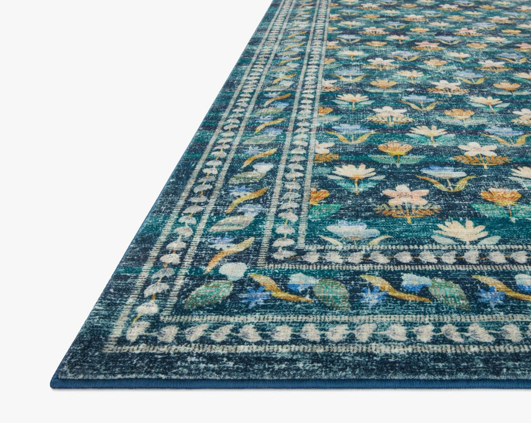 Angled view of the Hadley Emerald rug showing the soft CloudPile surface and bordered edge - Loloi Rugs - Whats New Furniture Portland