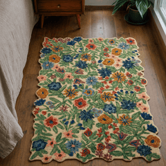 Edith Ivory Multi floral accent rug styled on a wood floor beside a bed in a Portland home - Whats New Furniture
