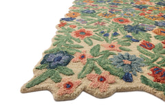 Angled view of the Edith Ivory Multi rug showing the sculpted flower edge and tufted texture - Whats New Furniture Portland