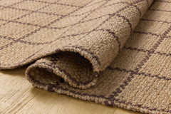 Rolled corner of the Fletcher Natural Brown jute rug showing weave and backing - Whats New Furniture Portland OR