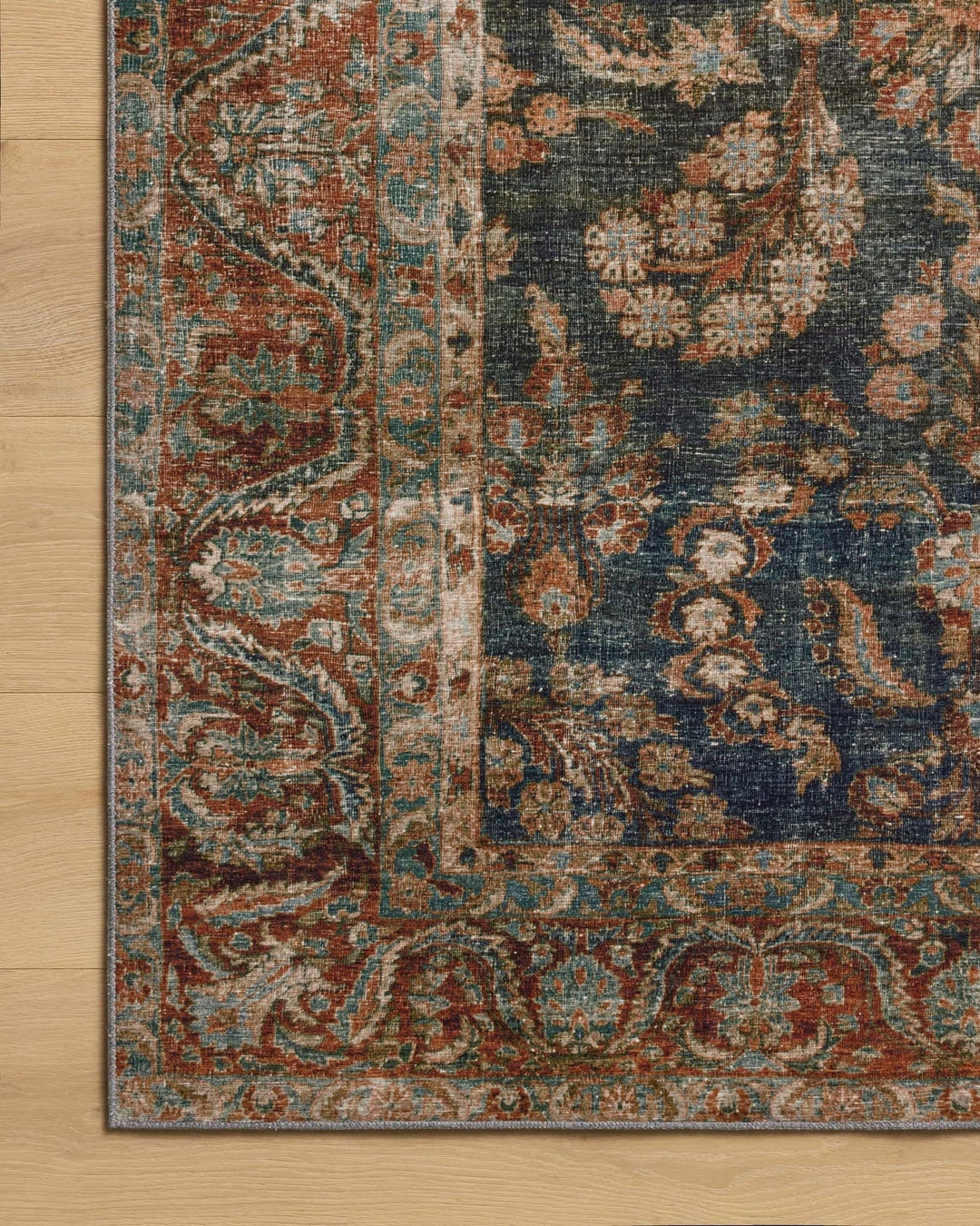 Border detail of the Jules Ocean Spice rug showing the rust medallion frame - Whats New Furniture Portland OR