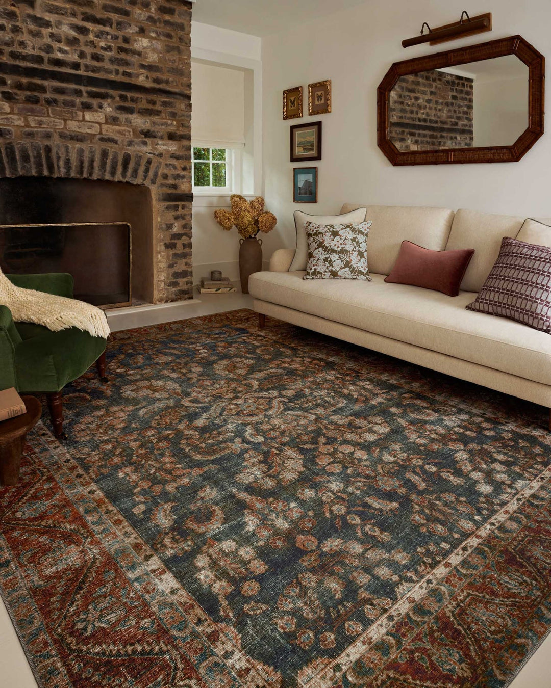 Ocean Spice Jules rug styled in a living room with a brick fireplace and cream sofa - Whats New Furniture