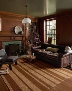 Weatherstaff Cinnamon rug styled in a wood-paneled library living room - Leanne Ford x Loloi - Whats New Furniture Portland OR