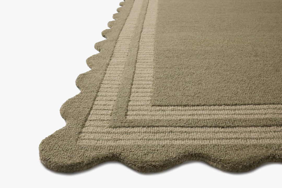 Angled view of the Scottie Olive/Pebble rug showing pile depth and the lower-pile striped scalloped edge - Loloi Rugs - Whats New Furniture Portland