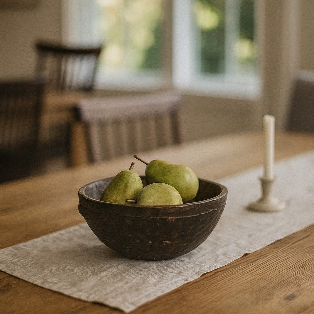 Vintage hand-carved wood milking bowl styled with pears on a Portland dining table - Whats New Furniture
