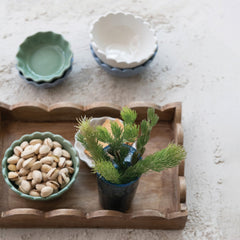 Mango Wood Scalloped Tray Natural - styled with pistachios and a small plant - Creative Co-Op - What&
