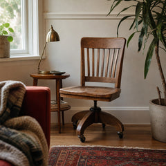 Medium oak brown vintage bankers chair with spindle back and saddle seat by Heywood Wakefield - view 2