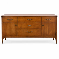 Medium walnut mid-century dresser with clean lines and a low, wide silhouette