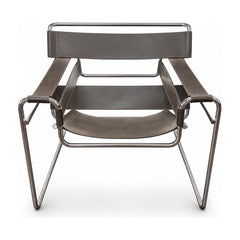 Mocha leather mid-century armchair with worn hide and compact club silhouette