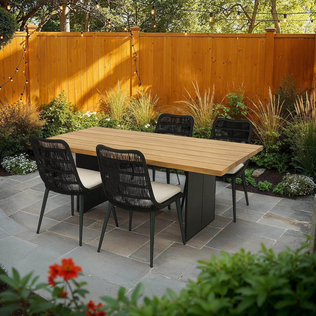 Naples Outdoor Dining Set with 4 Chairs on a stone paver patio - What&