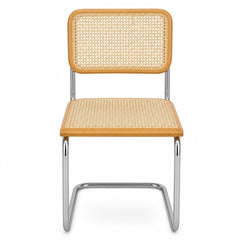Natural cane and chrome dining chair with a woven cane back and slim polished frame