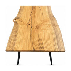 Natural handmade coffee table with a low rectangular wood top.