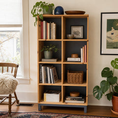 Natural wood bookcase with open shelves and minor damage on the top surface. - detail view 1