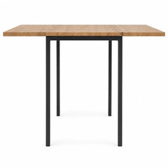 Natural wood and black mid-century dining table with drop leaves