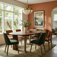 Drego Oval Dining Table in Dark Walnut with green and rust dining chairs in a Portland dining room - Whats New Furniture