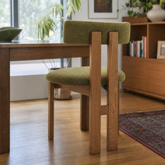 Hailey Dining Side Chair in Palladian Green, bouclé dining chair beside a wood dining table in a Portland home - Whats New Furniture