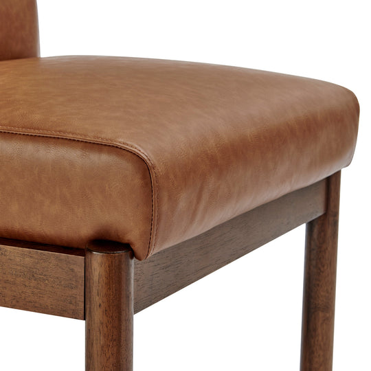 Micah Dining Side Chair Vintage Cider walnut leg and seat junction detail - What&