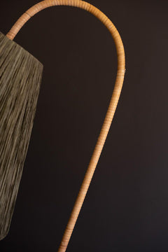 Rattan-Wrapped Arc Floor Lamp with Olive Raffia Shade close on the rattan-wrapped arc - lighting by Kalalou - Whats New Furniture Portland OR