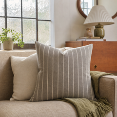 Rhett Earth Ticking Stripe Throw Pillow styled in a Portland Alberta Arts sitting room lifestyle - Whats New Furniture