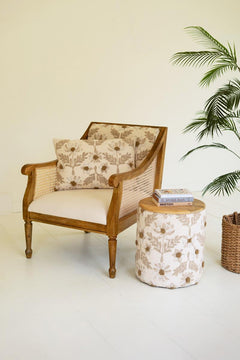 Round Embroidered Accent Table with Mango Wood Top beside a cane armchair with books on top - side tables by Kalalou - Whats New Furniture Portland OR