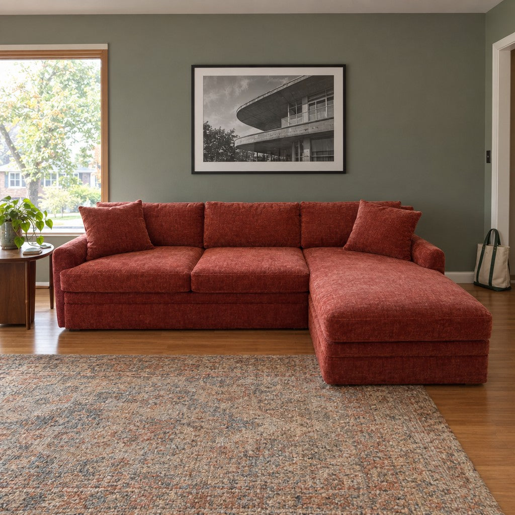 Rust chaise sectional with an extended chaise lounge end. - detail view 1