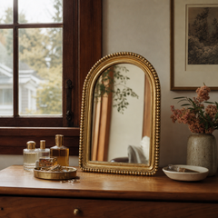 Gold beaded arch vanity mirror styled on a Portland dresser - Whats New Furniture