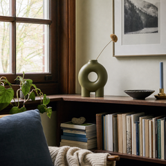 Olive donut footed vase styled on a Portland shelf - Whats New Furniture