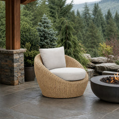 Siesta Outdoor Round Club Chair on a covered outdoor veranda with a low fire table nearby - What&