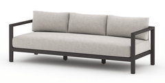Sonoma Outdoor Sofa, Bronze in Venao Grey side angle - teak outdoor sofa by Four Hands - Whats New Furniture Portland OR