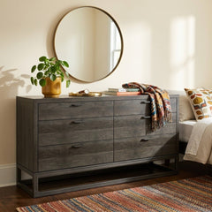 Stark 6-Drawer Dresser in Espresso Oak styled in a Portland bedroom with round brass mirror and pilea plant - Whats New Furniture