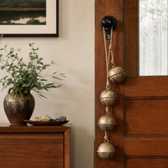 String of Brass Finish Bells styled in a Portland home - home decor by Kalalou - Whats New Furniture Portland OR