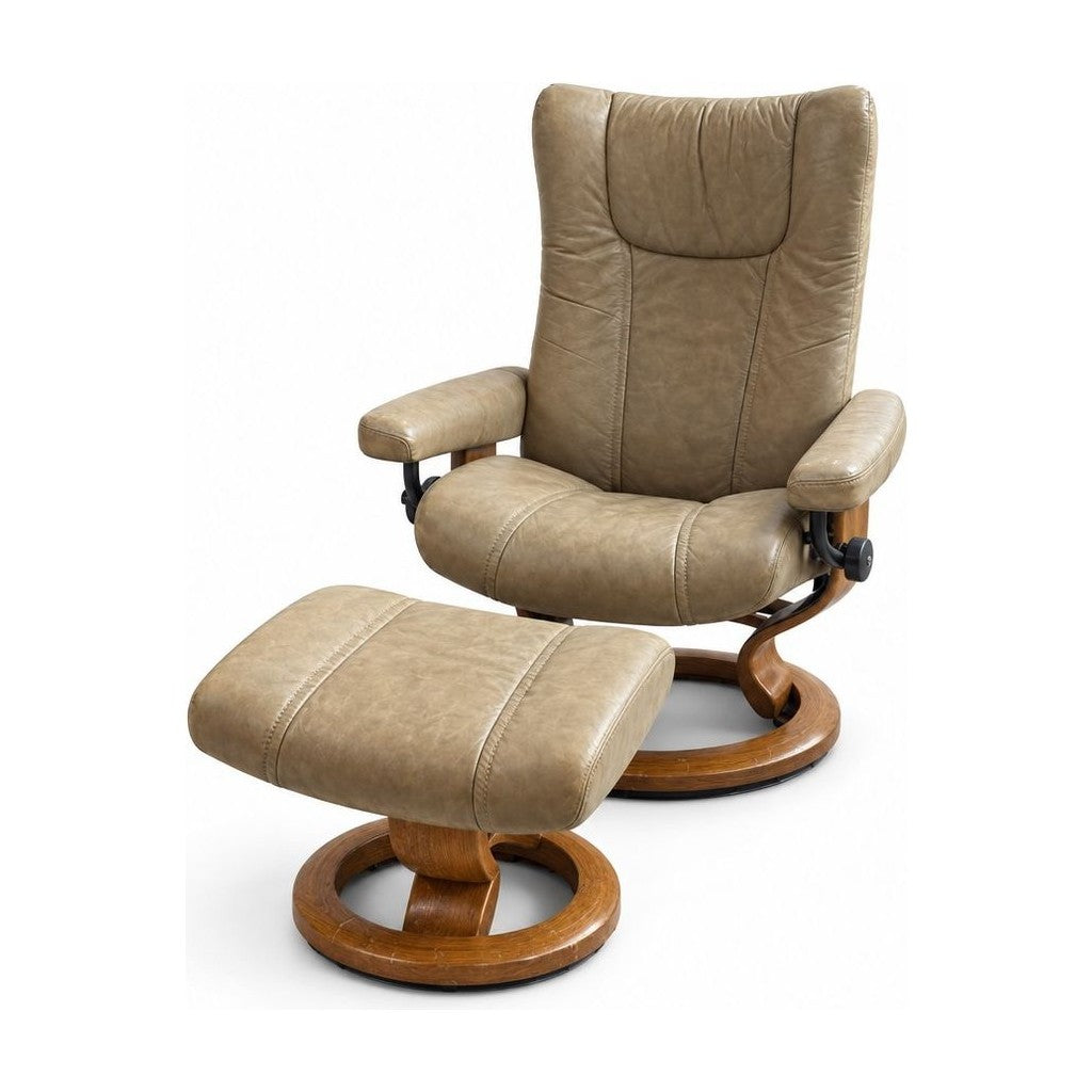 Taupe recliner with attached side table and mid-century silhouette.