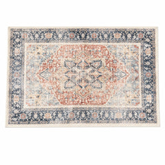 Terracotta and navy accent rug with a geometric woven pattern