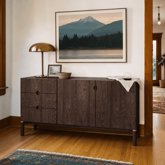 Arun sideboard in espresso oak styled in a Portland dining room with PNW landscape art and brass accents - 63 inch Scandinavian buffet by Unique Furniture - Whats New Furniture