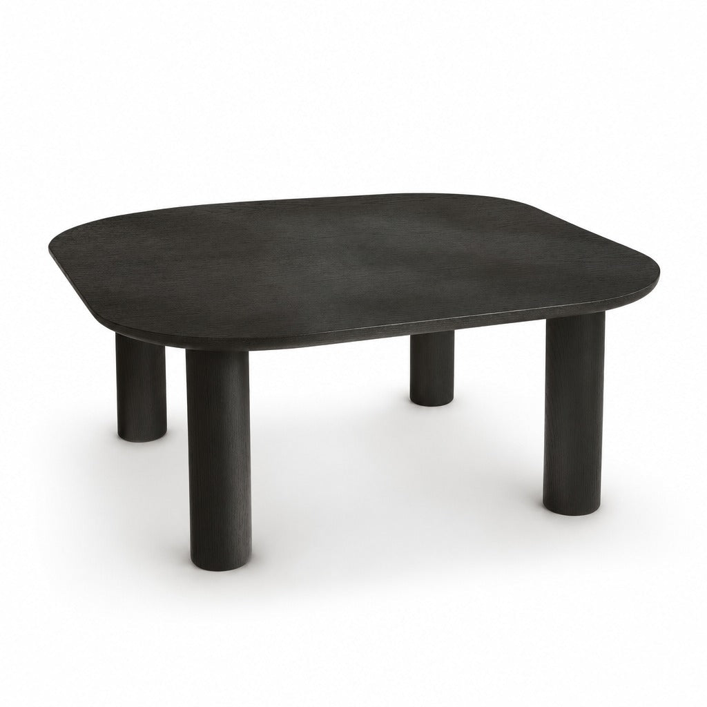 Monsun 31.5 inch square coffee table in black oak with four cylindrical legs, studio view