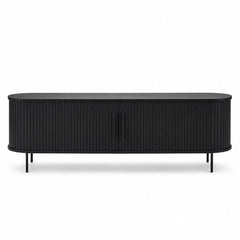 Black fluted oak TV lowboard with curved oval silhouette and sliding tambour doors