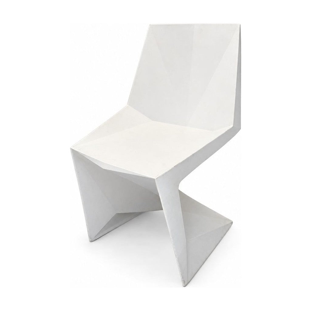 White geometric dining chair with an angular molded shell by VONDOM
