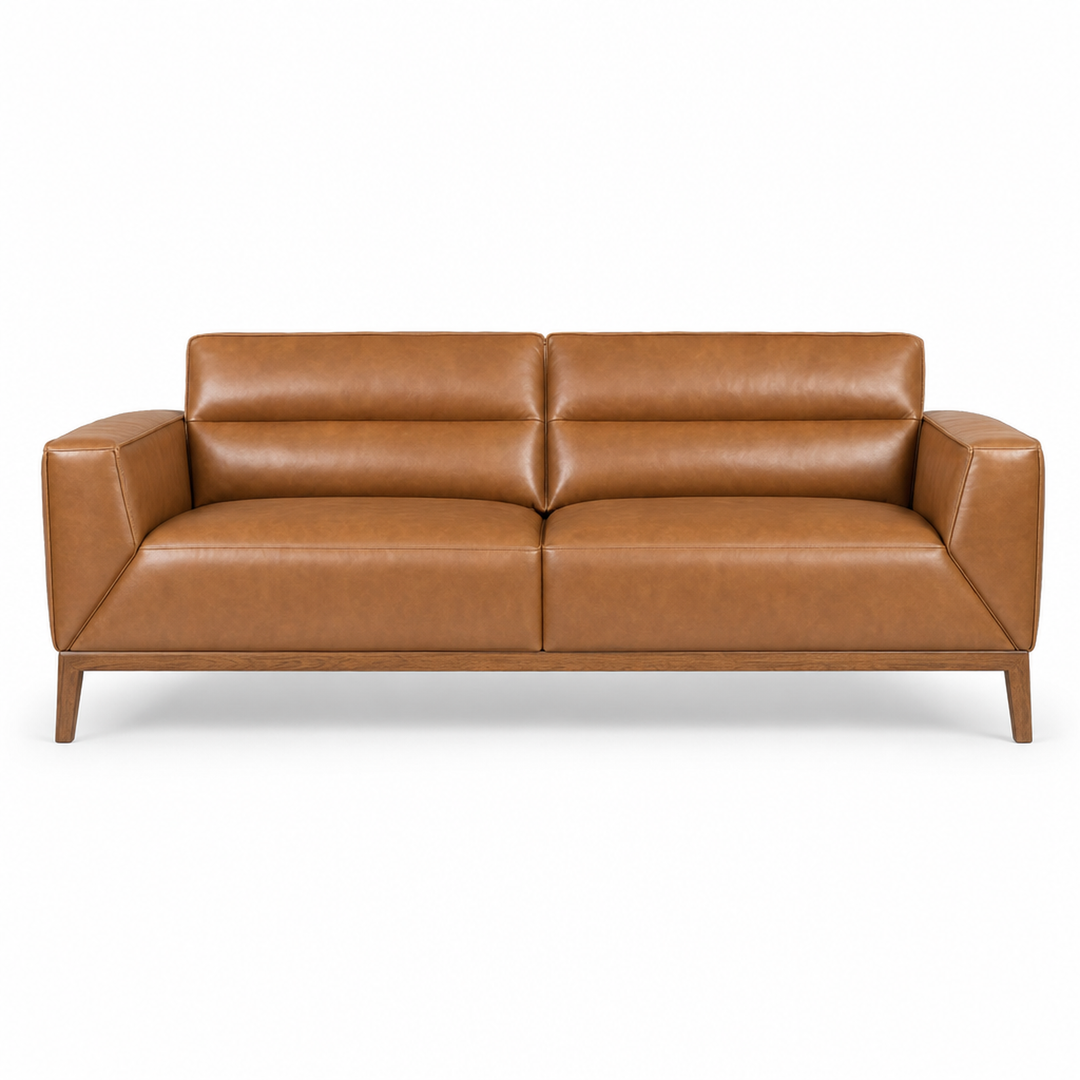 Oro top-grain leather sofa in camel on a white studio background - What’s New Furniture Portland
