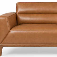 Close-up of the angled arm and stitched seam on the camel Oro leather sofa - What’s New Furniture Portland