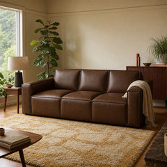 Solado Top-Grain Leather Sofa in Mahogany beside a console in a warm living room - Whats New Furniture