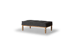 Lewis Fabric-Top Coffee Table in anthracite tufted top on wood frame — front three-quarter angle — What&