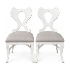 White dining chairs sold as a matching set of two with clean contemporary lines.