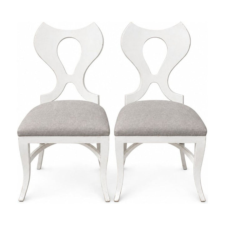 White dining chairs sold as a matching set of two with clean contemporary lines.