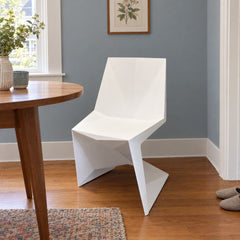 White geometric dining chair with an angular molded shell by VONDOM - detail view 1