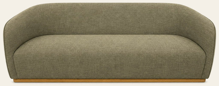 Green mid-century sofa with warm oak trim and clean horizontal lines - Whats New Furniture Portland OR