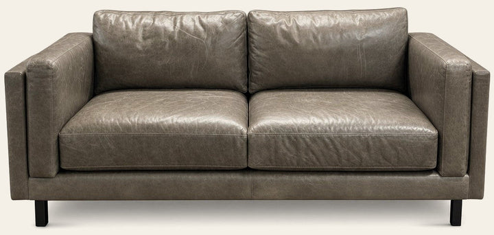 Gray leather sofa with low-slung lines and a hardwood frame by Room and Board - Whats New Furniture Portland OR