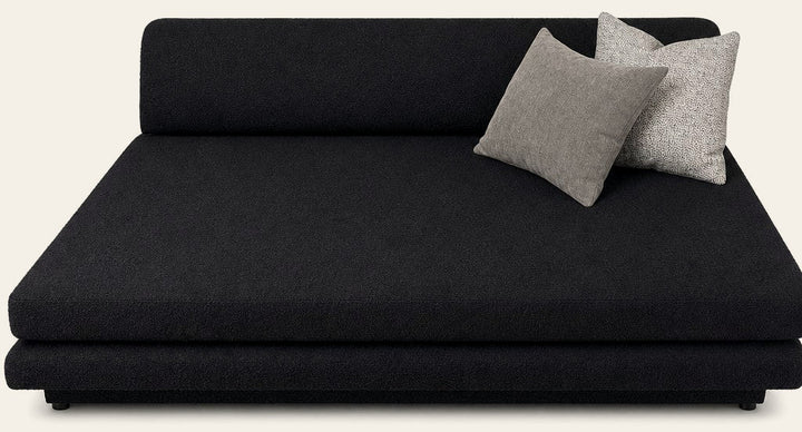 Black upholstered plinth lounge chaise longue with a low, grounded base - Whats New Furniture Portland OR