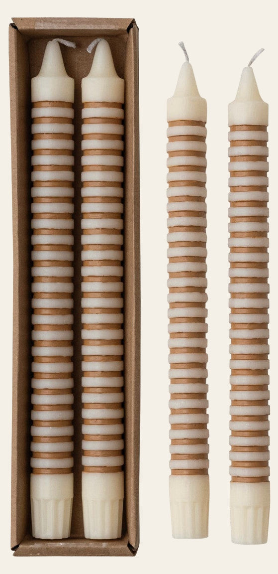 Tan striped taper candles in their box beside the pair of candles - Whats New Furniture Portland OR